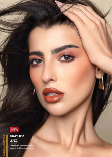 Woman with makeup and jewelry on a beige background