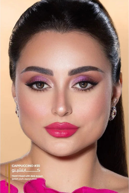 Close-up of a woman with pink makeup on a beige background